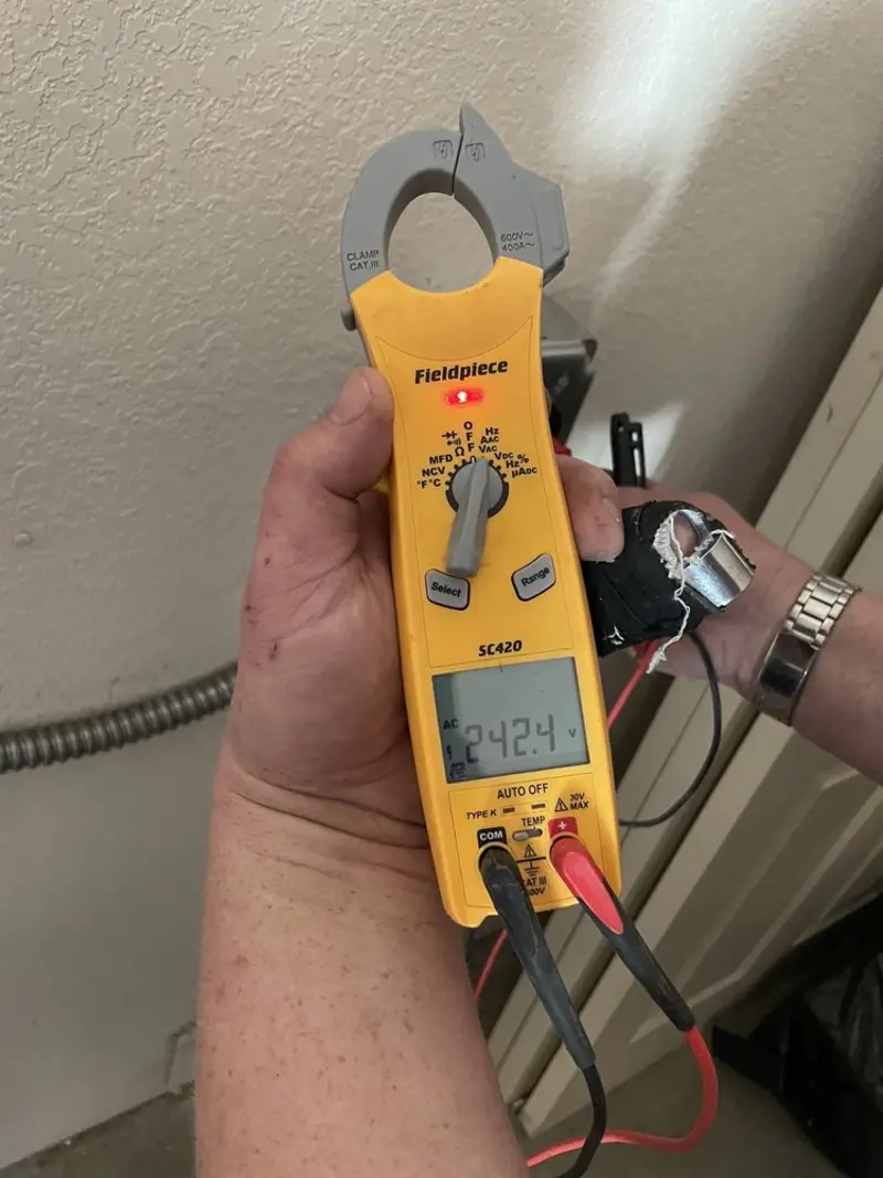 Voltage testing with clamp meter during Aluminum Wiring Replacement in Boone